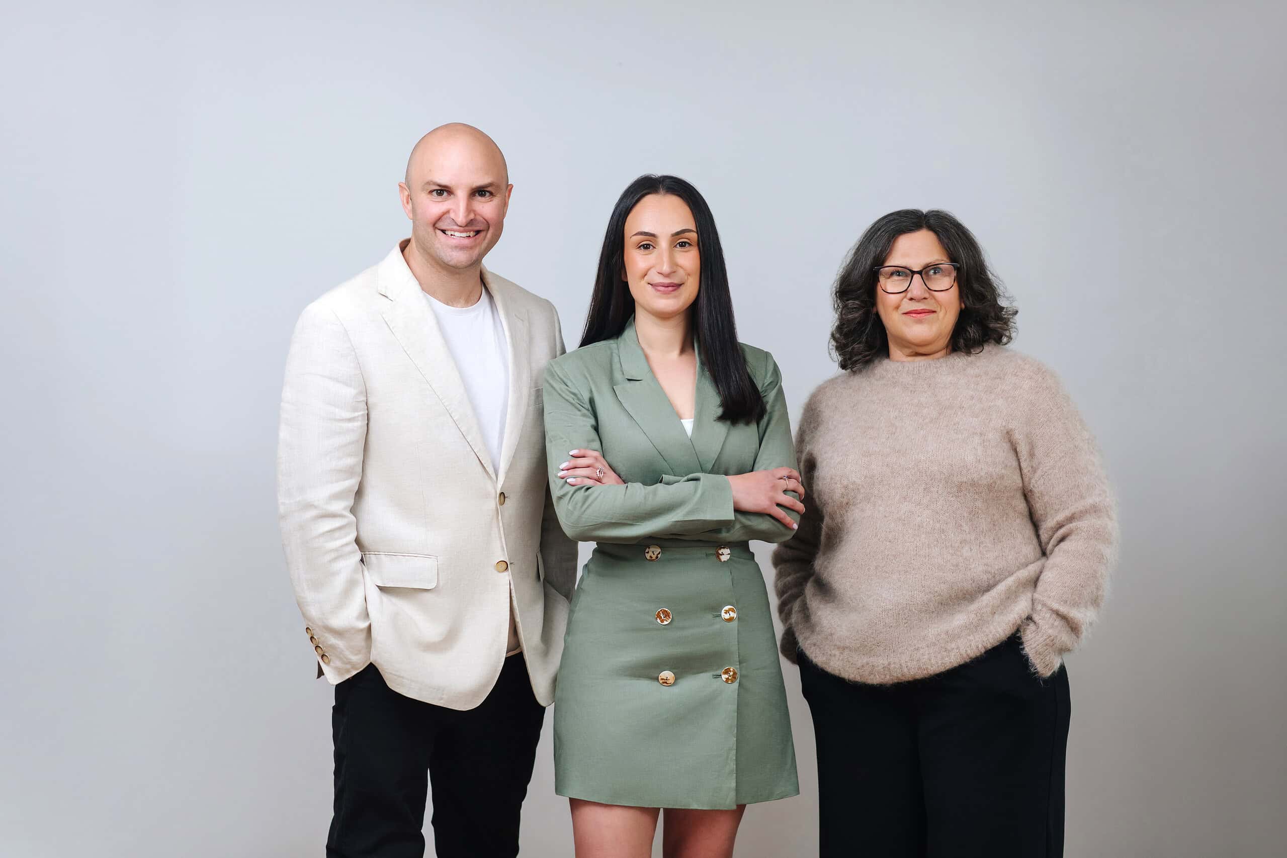 Friendly team of Ember Estate Agents with professional appearance, standing against a plain background, representing trusted property experts in the local real estate market.