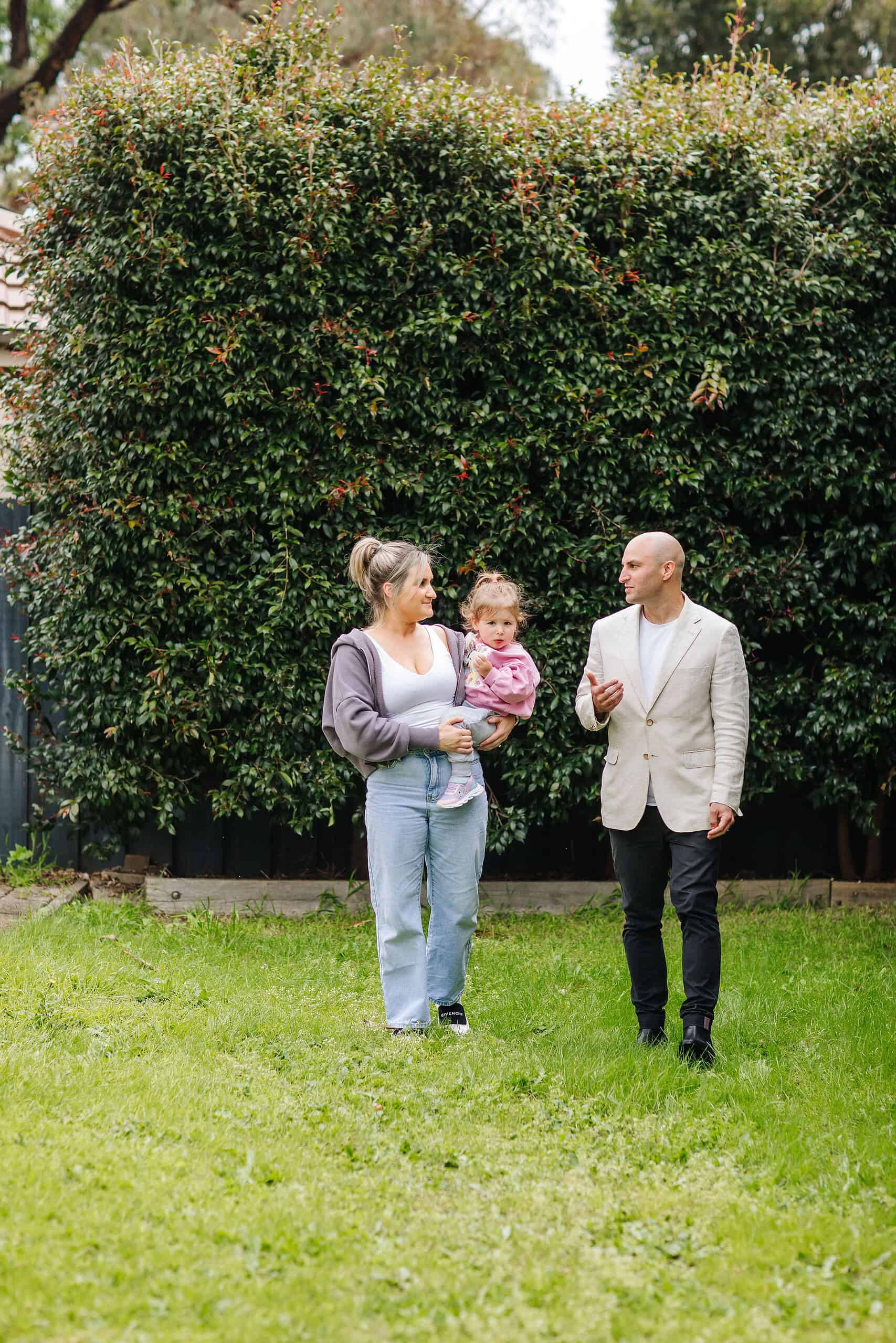 Spacious backyard with lush green grass, perfect for family gatherings and outdoor activities at Ember Estate Agents.