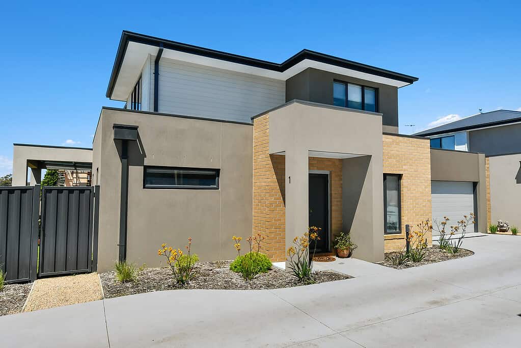 Modern contemporary house exterior with sleek design, landscaped garden, and garage in Ember Estate, showcasing expert property sales and real estate services in Ember, Brisbane.